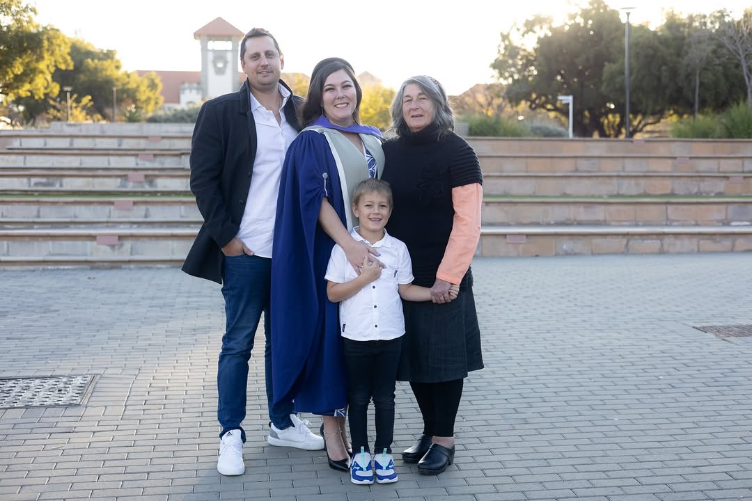 Candid shot of graduate throwing cap